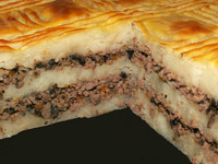 Картофельная запеканка с грибами и куриными сердечками